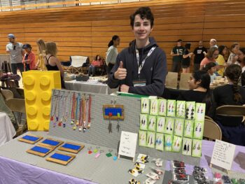 Overview of West Hills High gym with Santee Children's Business Fair tables in place