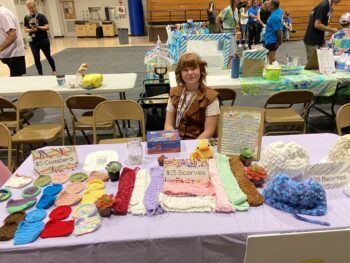 Overview of West Hills High gym with Santee Children's Business Fair tables in place