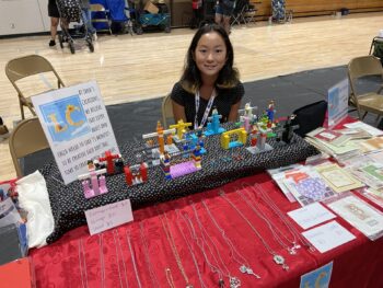 Overview of West Hills High gym with Santee Children's Business Fair tables in place