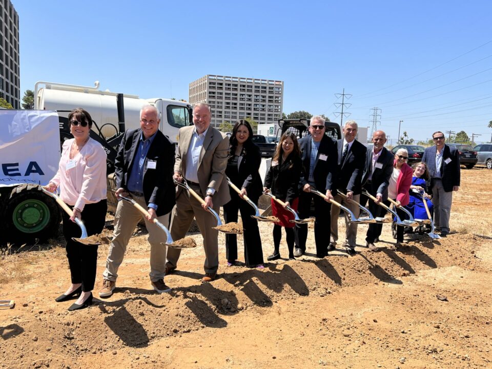 dignitaries standing with shovels in Clairemont
