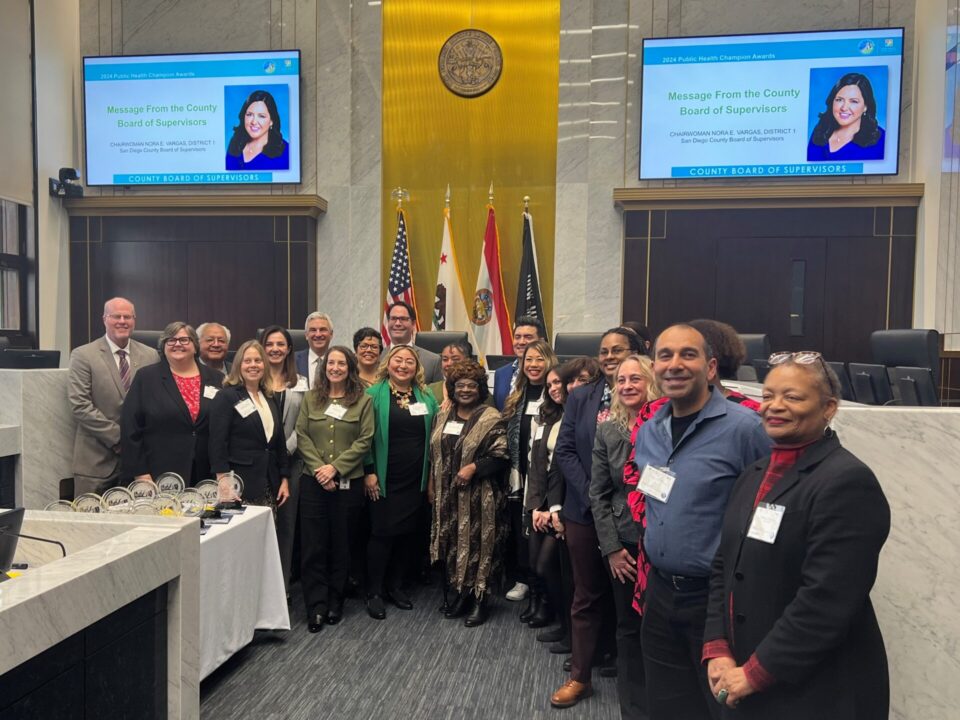 group of people in the Board of Supervisors chambers