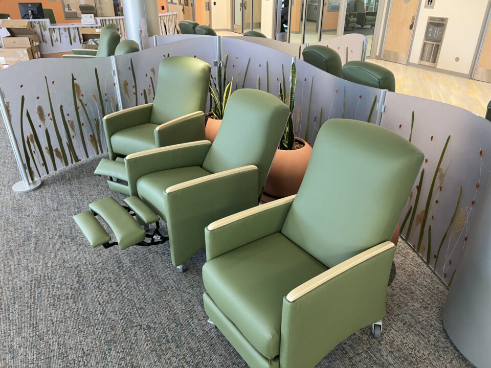 three green recliner chairs