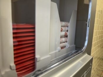 Pads and tampons inside dispenser.