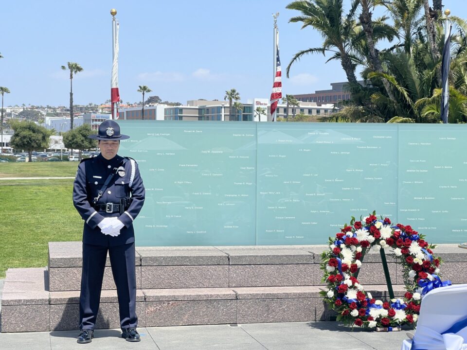 San Diego Law Enforcement standing in front of Memorial wall