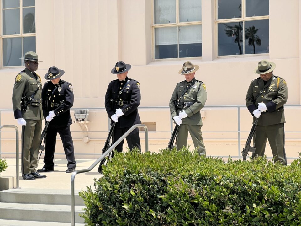 San Diego Law Enforcement saluting at memorial ceremony.