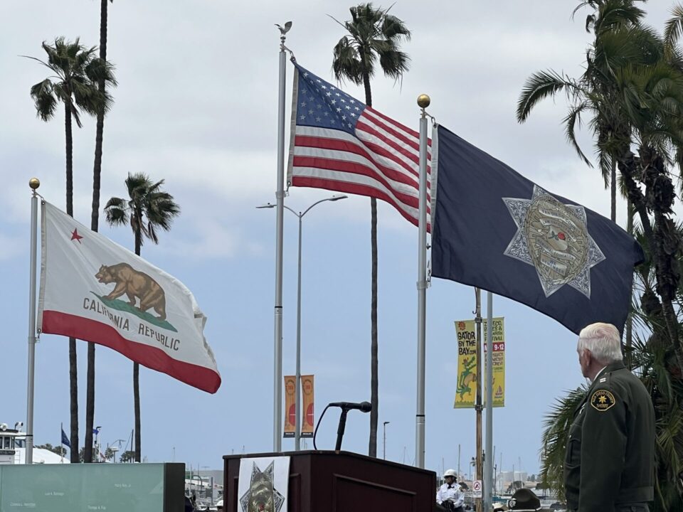 Flags raised at San Diego Law Enforcement memorial ceremony.