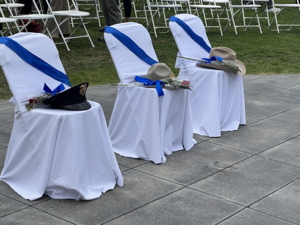 Hats on chair at San Diego Law Enforcement memorial ceremony.