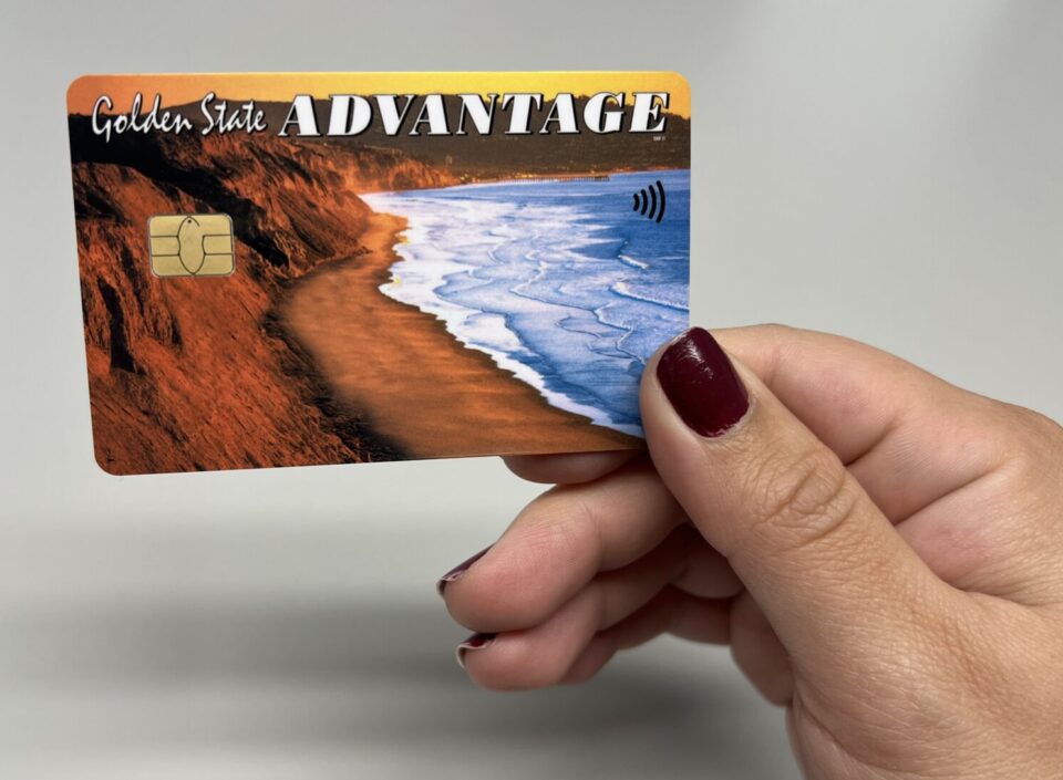 Hand holding new EBT chip card