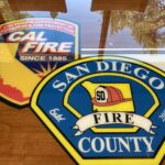 Dining table with CAL FIRE seal and San Diego County Fire seal