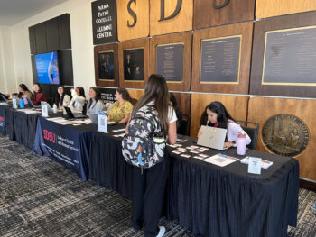 Student checking in at registration desk