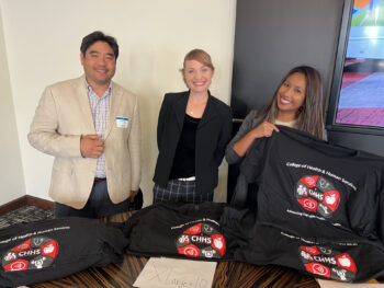 County employees in front of tshirt table
