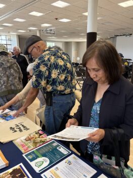 Seniors read over safety information at table