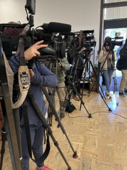 many camera and camera people line up