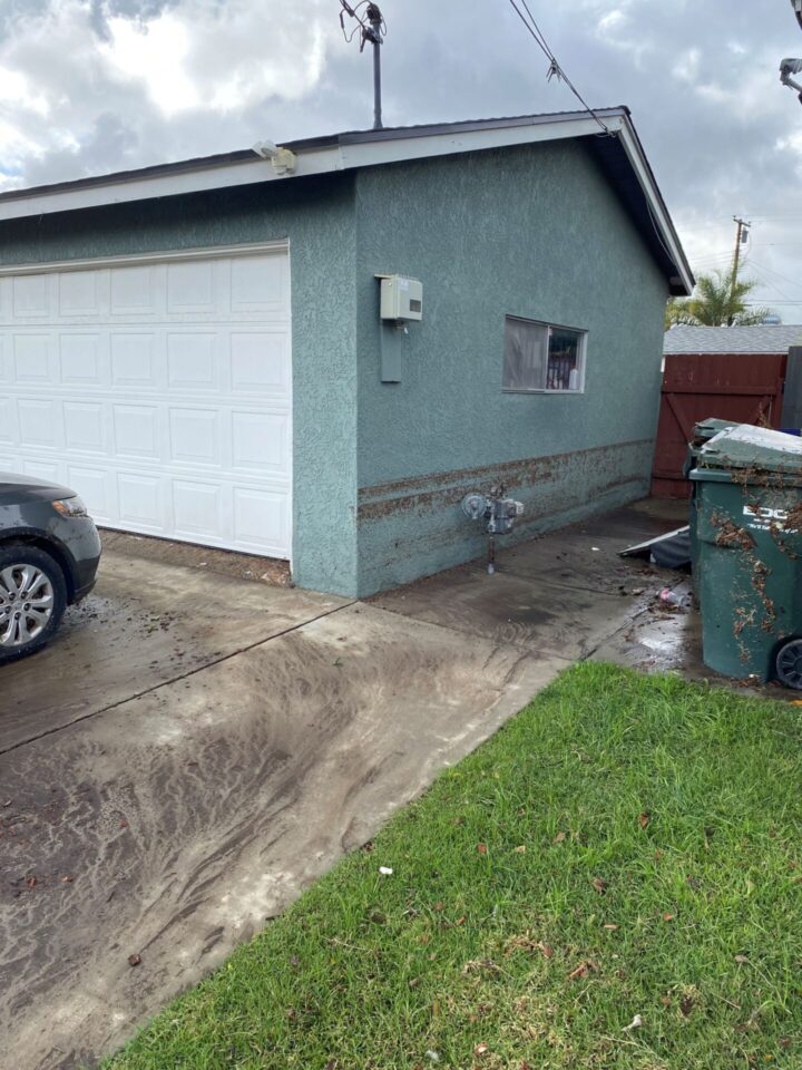 The side of a water-damaged house
