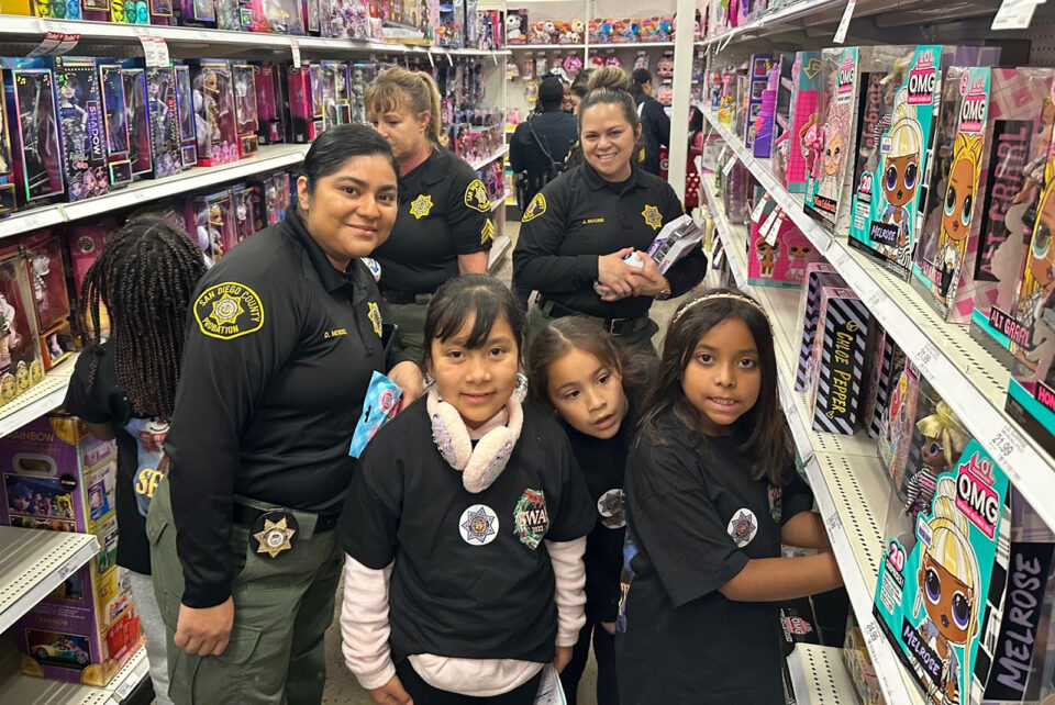 Girls with Probation officers shopping