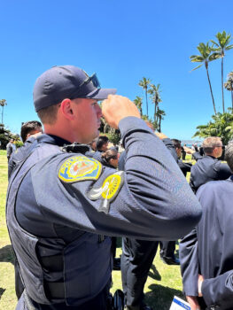 La Mesa Police officer salutes