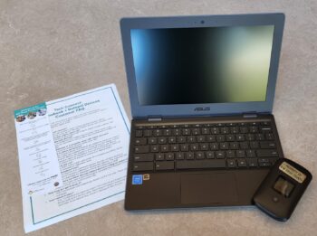 laptop computer with instruction sheet