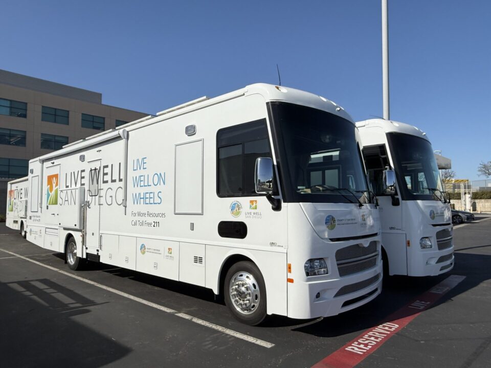 two buses parked next to each other