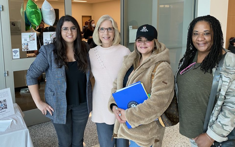 group of woman stand in lobby