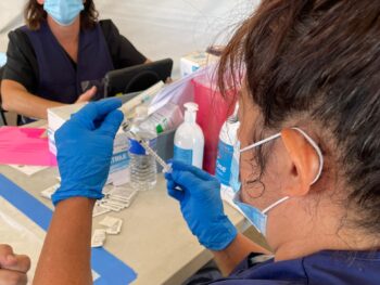 Nurse prepares syringe from JYNNEOS vial
