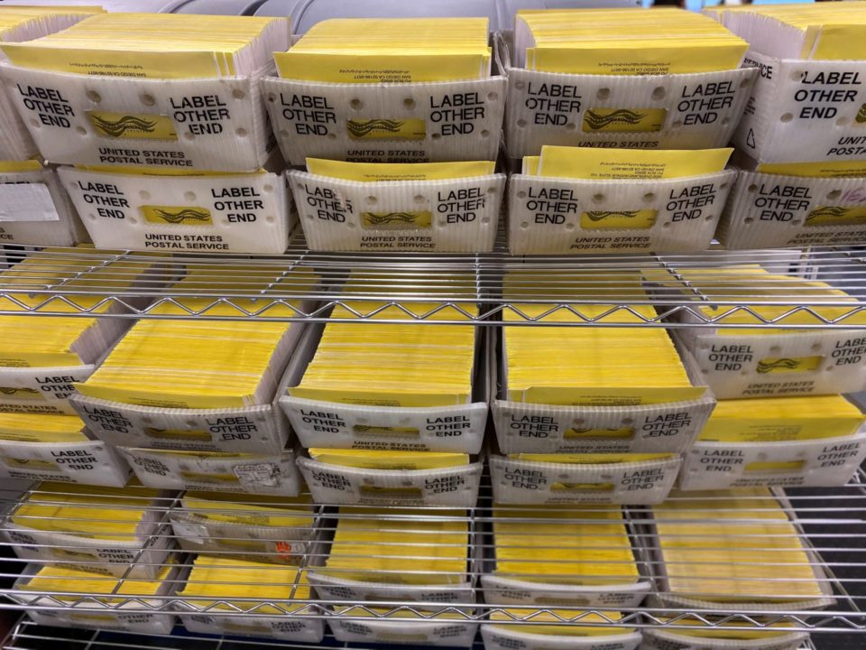 returned mail ballots on shelves