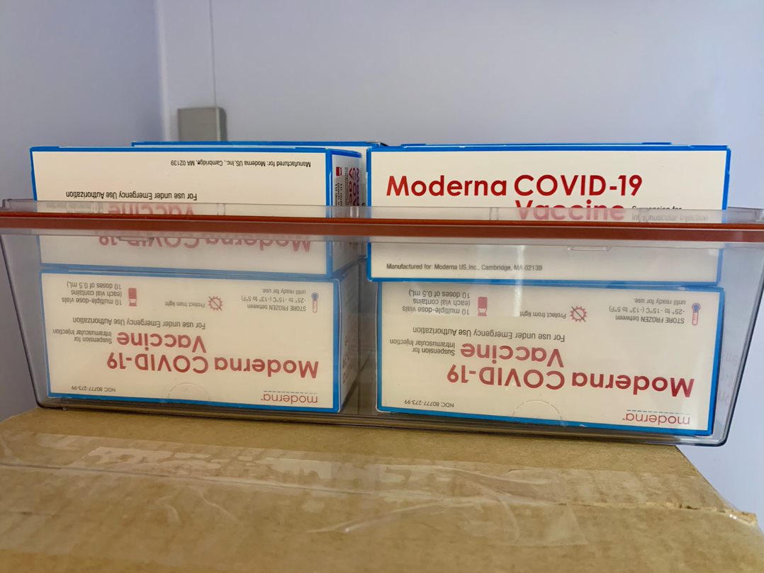 Boxes of vaccine on a table