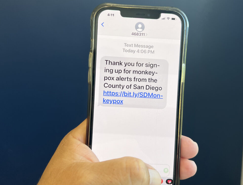 image of a phone with a text alert