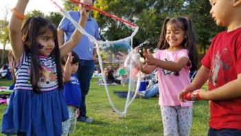 children playing with bubbles