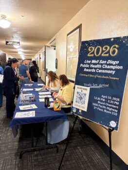 People checking in at registration table 