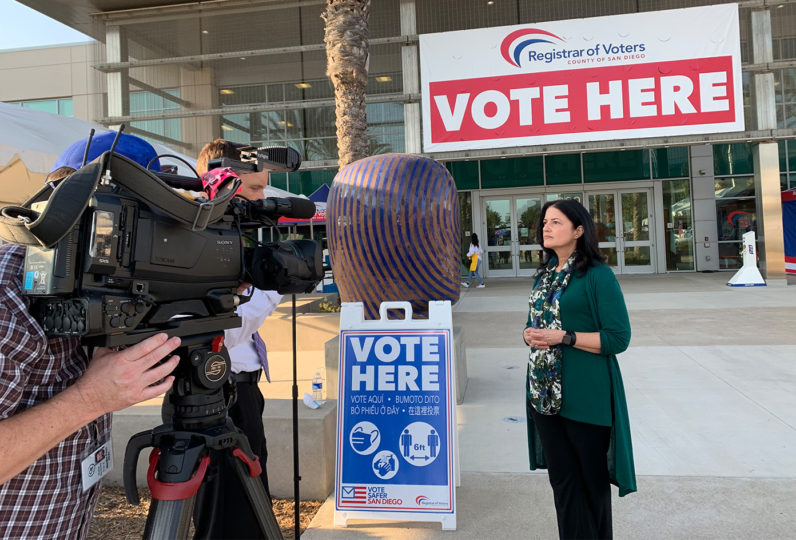 Cynthia Paes being interviewed outside the Registrar of Voters