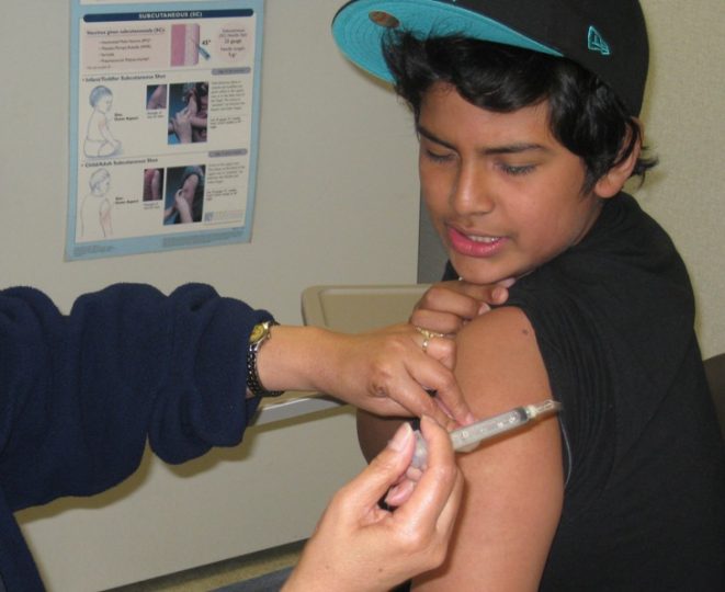a teen getting a whooping cough vaccine