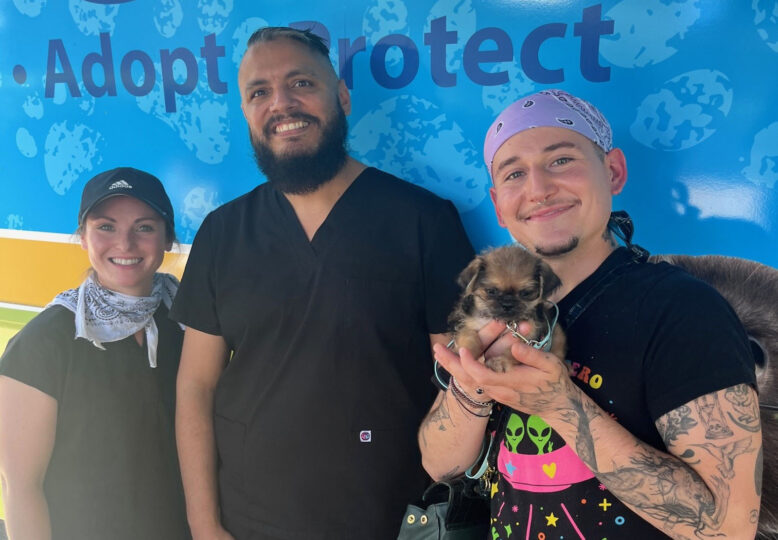 Puppy and three people