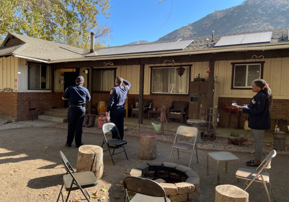 County Fire inspectors look around a home to check for fire vulnerabilities.