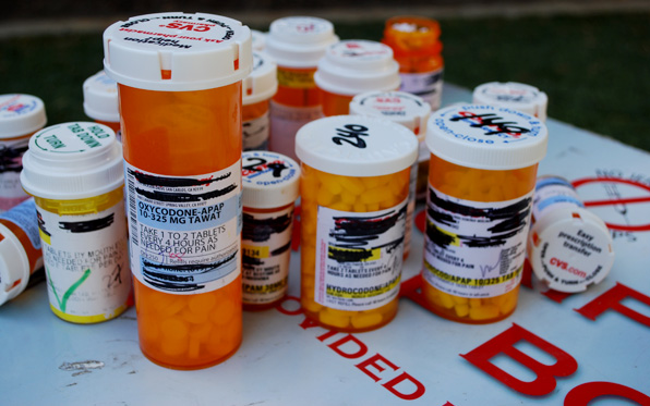 a picture with bottles of prescription drugs