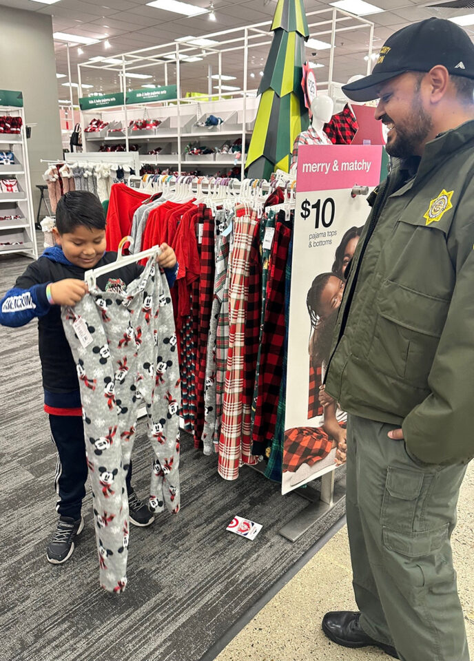 Boy showing Probation officer some pants