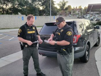 Two Probation officers review list