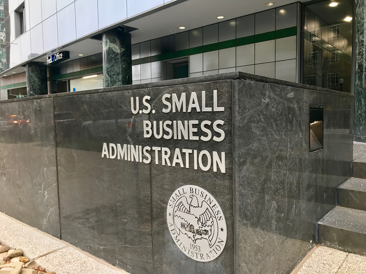 Signage on marble block outside D.C. building