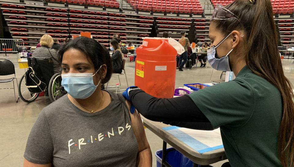 one woman vaccinates another woman