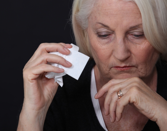 woman holding tissue