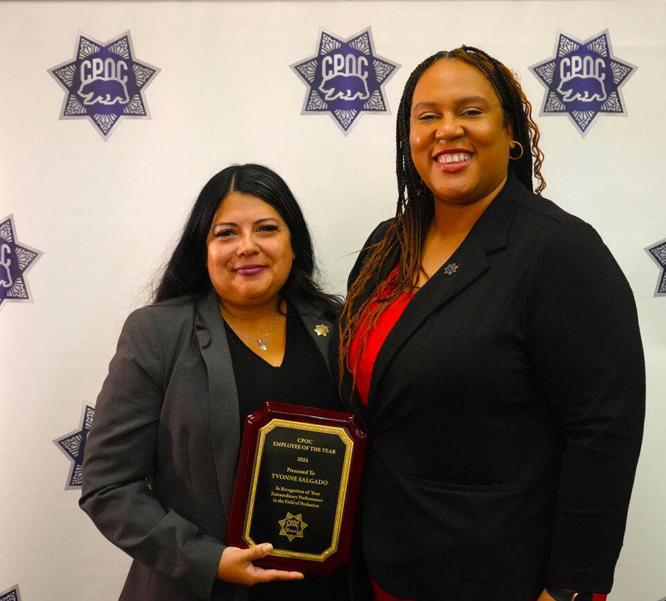 Yvonne Salgado and Chief Probation Officer Tamika Nelson holding award