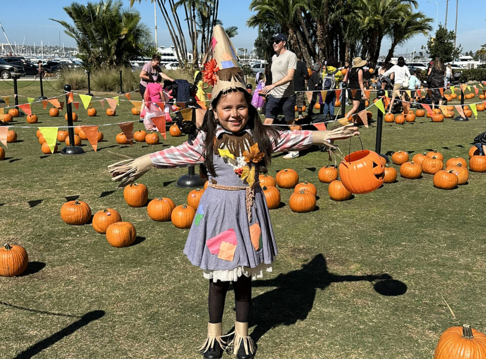 Girl dressed as scarecrow at Waterfront Park