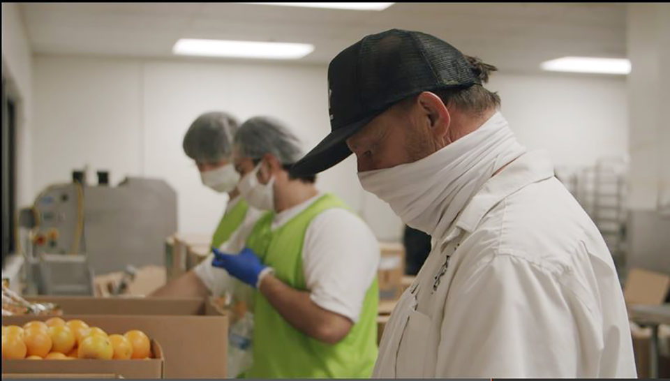 Sheriff's staff preparing meals for unsheltered.