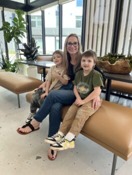 Mother sitting with her two children