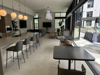 Indoor community room with chairs, tables and couch