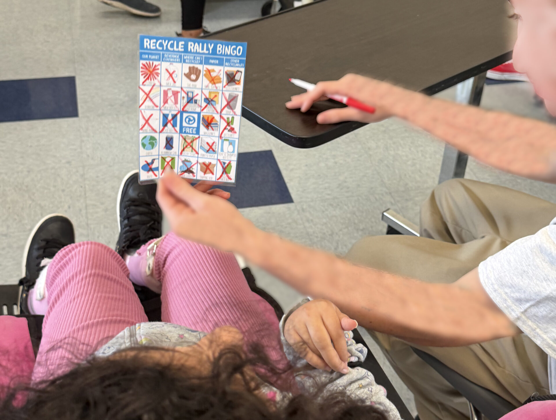 Two students playing bingo