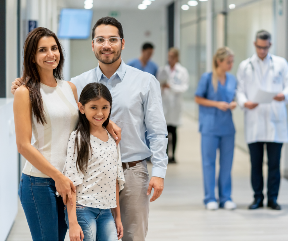 Family, mother father and child standing in a medical facility