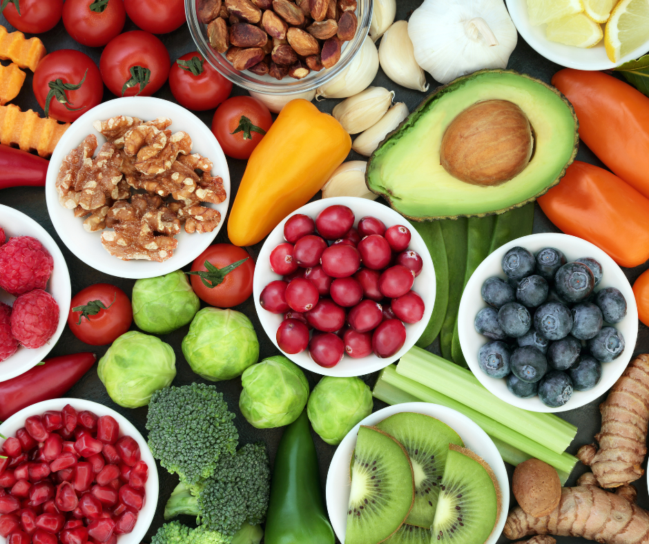 fruits and vegetables in small bowls on table