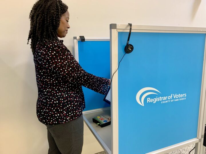 womean stand at booth