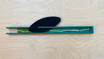 woodwork with a branch inside a channel