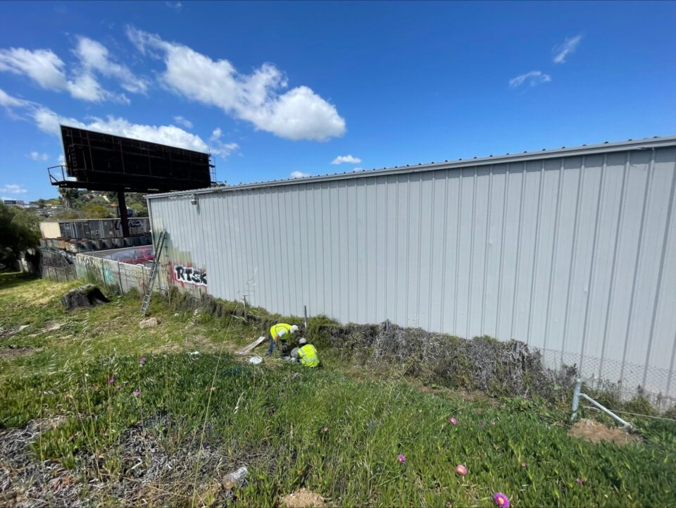 A wall partially covered by graffiti